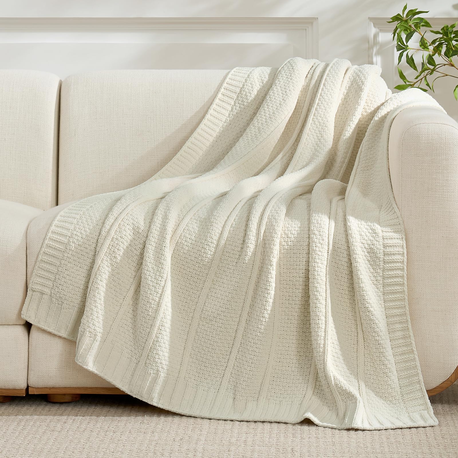Amélie Home chenille throw draped on sofa adds cozy ambiance.