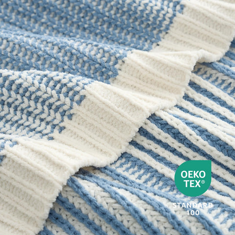 Amélie Home throw wrapped around shoulders for warmth and style