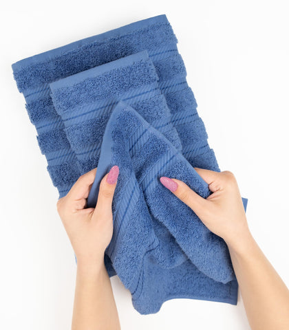 American Soft Linen four-piece bathroom towel set in electric blue for coordinated decor