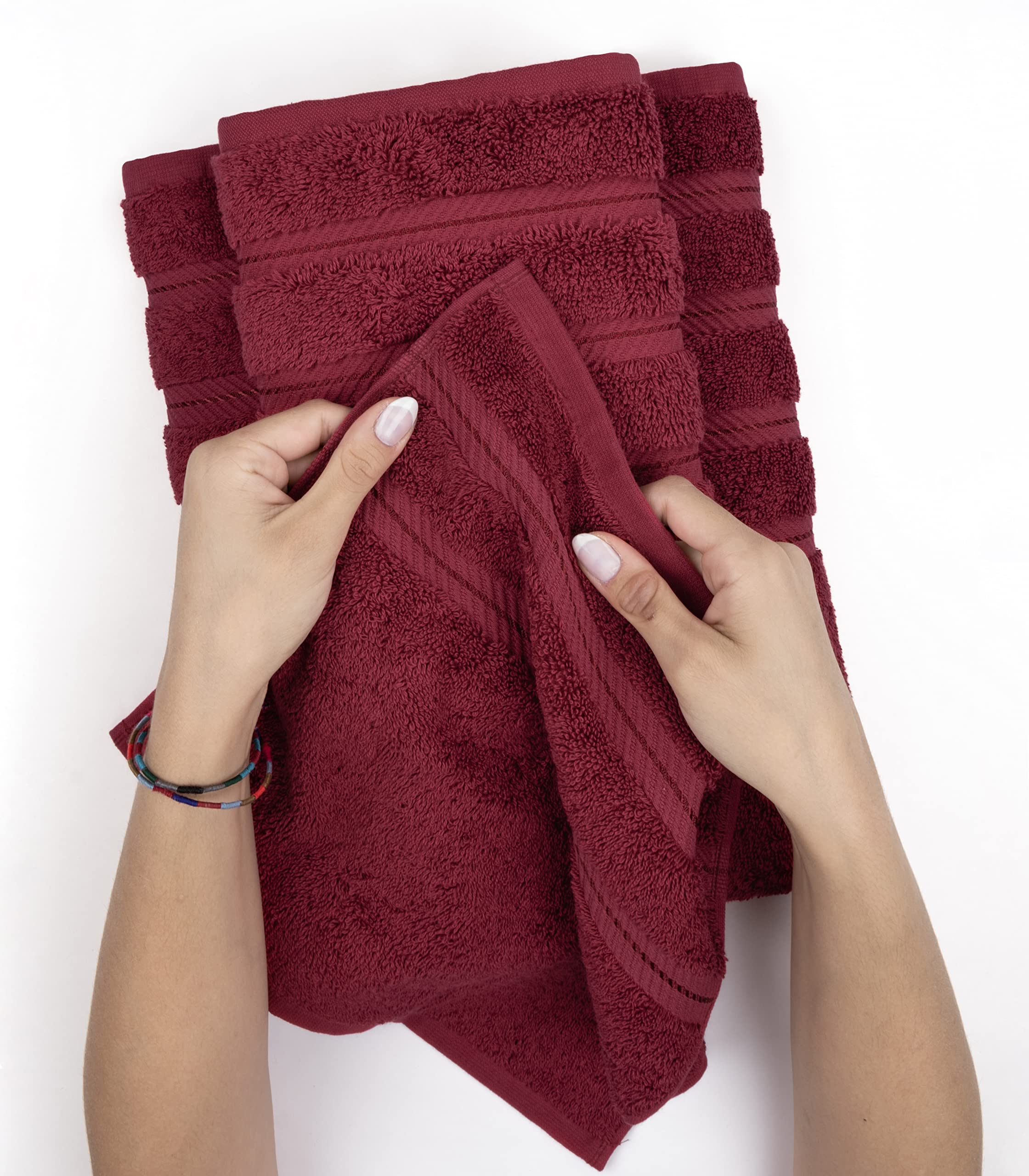 American Soft Linen Bordeaux red towels folded on vanity for daily use