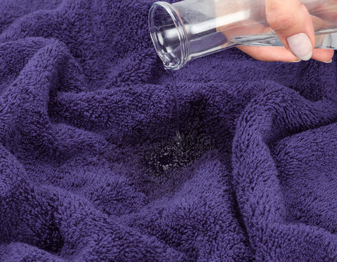 American Soft Linen purple towels show rich color variation.