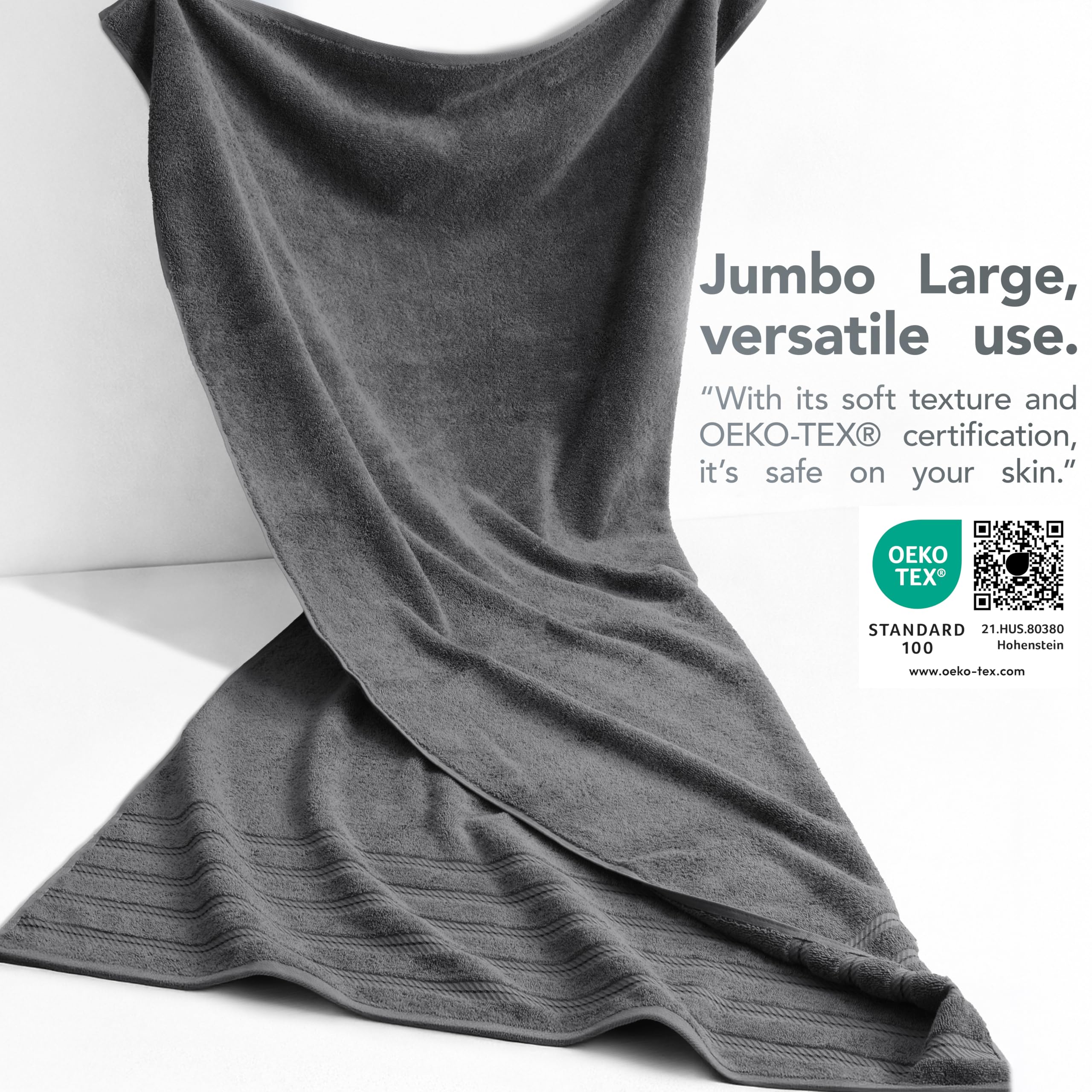American Soft Linen dark-gray towel on beach chair demonstrates oversized comfort.
