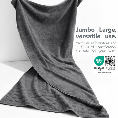 American Soft Linen dark-gray towel on beach chair demonstrates oversized comfort.