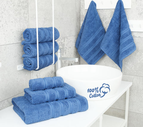 American Soft Linen electric blue hand towels displayed beside a sink for daily use.