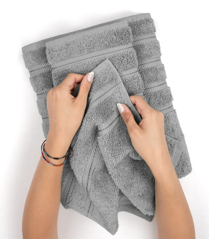 American Soft Linen four-piece towel set arranged in a bathroom