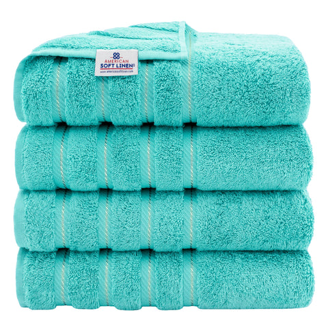 American Soft Linen luxury towels in turquoise four-piece set with plush, absorbent 600 GSM fabric.