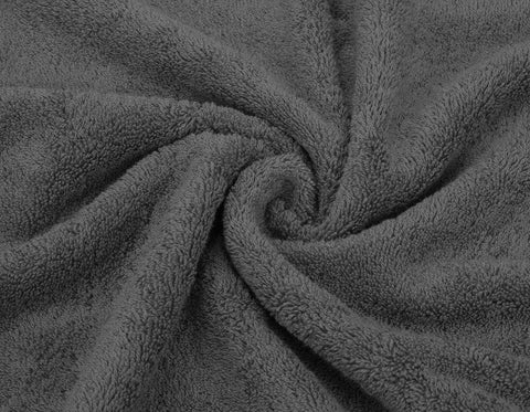 Quick-dry feature illustrated by the towel appearing light after a spin cycle.