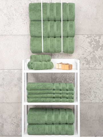 American Soft Linen Sage Green towels draped over towel bar