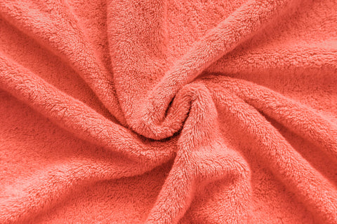 American Veteran Towel bathroom scene shows coral towels adding a hotel-like touch