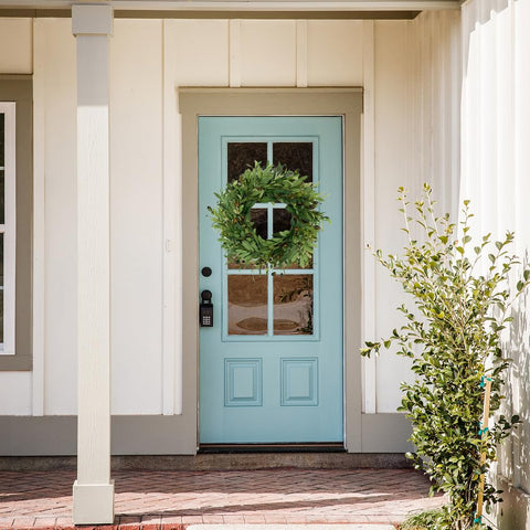 AMF0RESJ greenery wreath used as festival or seasonal decor accent.