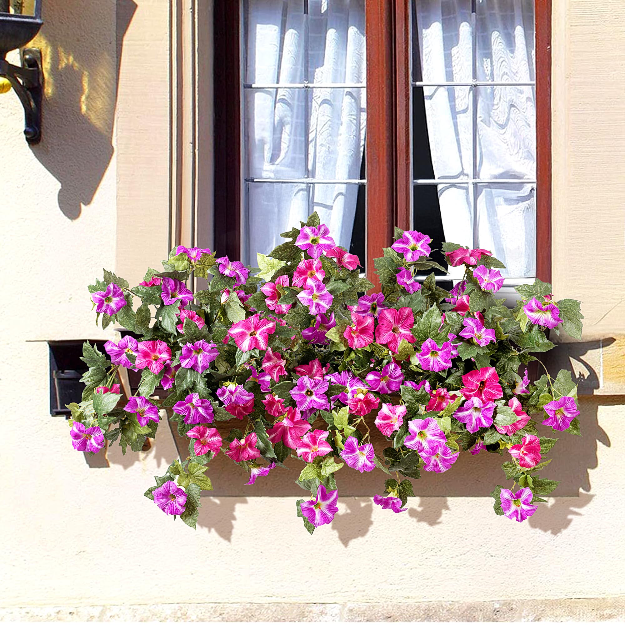 Ammyoo artificial petunias on balcony create welcoming color.