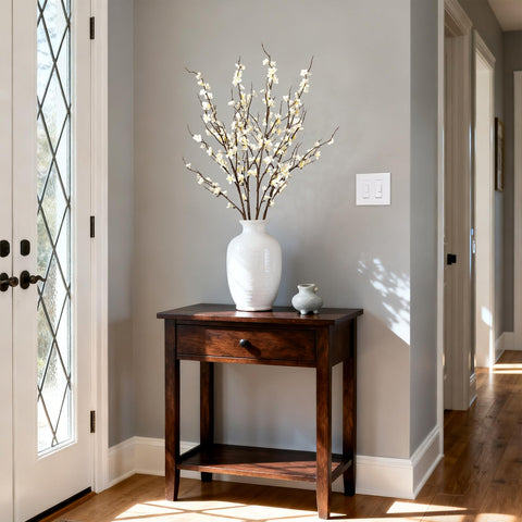 Ammyoo branch arranged in a tall vase for elegant display.