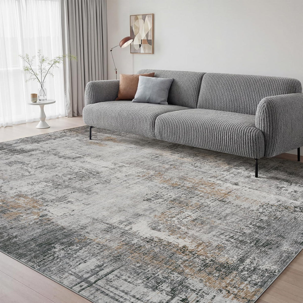 AMOAMI 5x7 abstract gray area rug in a living room enhances style and cozy comfort.
