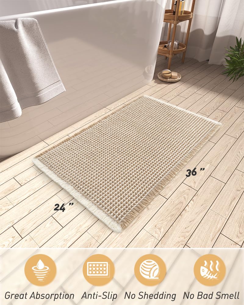 AMOAMI waffle mat tassel-detail adds stylish texture to any bath.