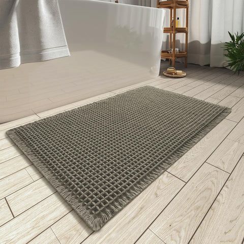 AMOAMI Upgraded Waffle Bath Mat in green offers soft comfort for your feet.