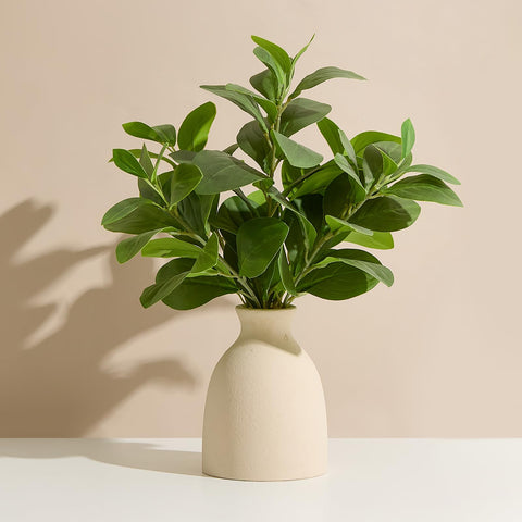 Amore Florals eucalyptus stems in eco vase elevate entryway decor.