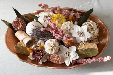 ANDALUCA table decor setup featuring spring potpourri centerpiece.