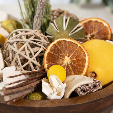 Andaluca vase filler blends botanicals with preserved and artificial flowers.