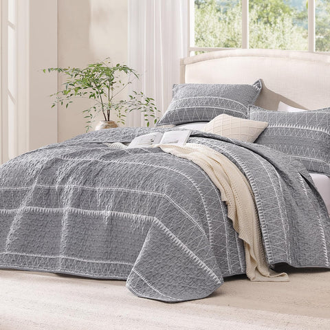 Andency boho striped coverlet adds stylish texture to the bed.