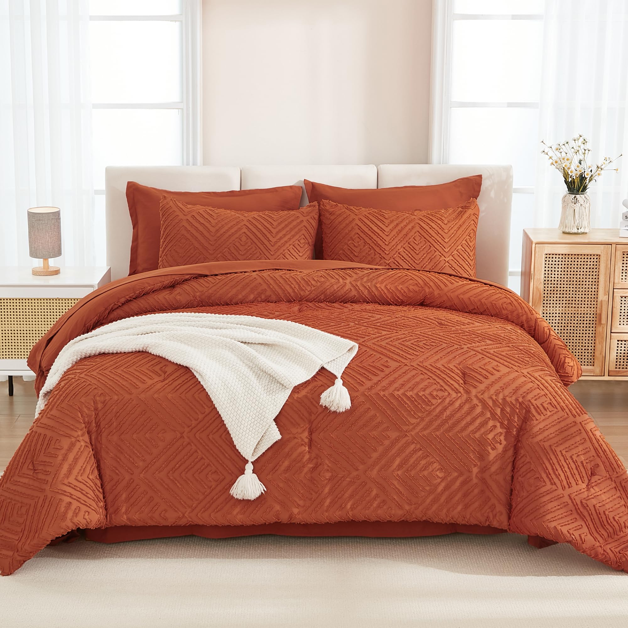 Andency terracotta geometric tufted design detail adds boho chic to the room.