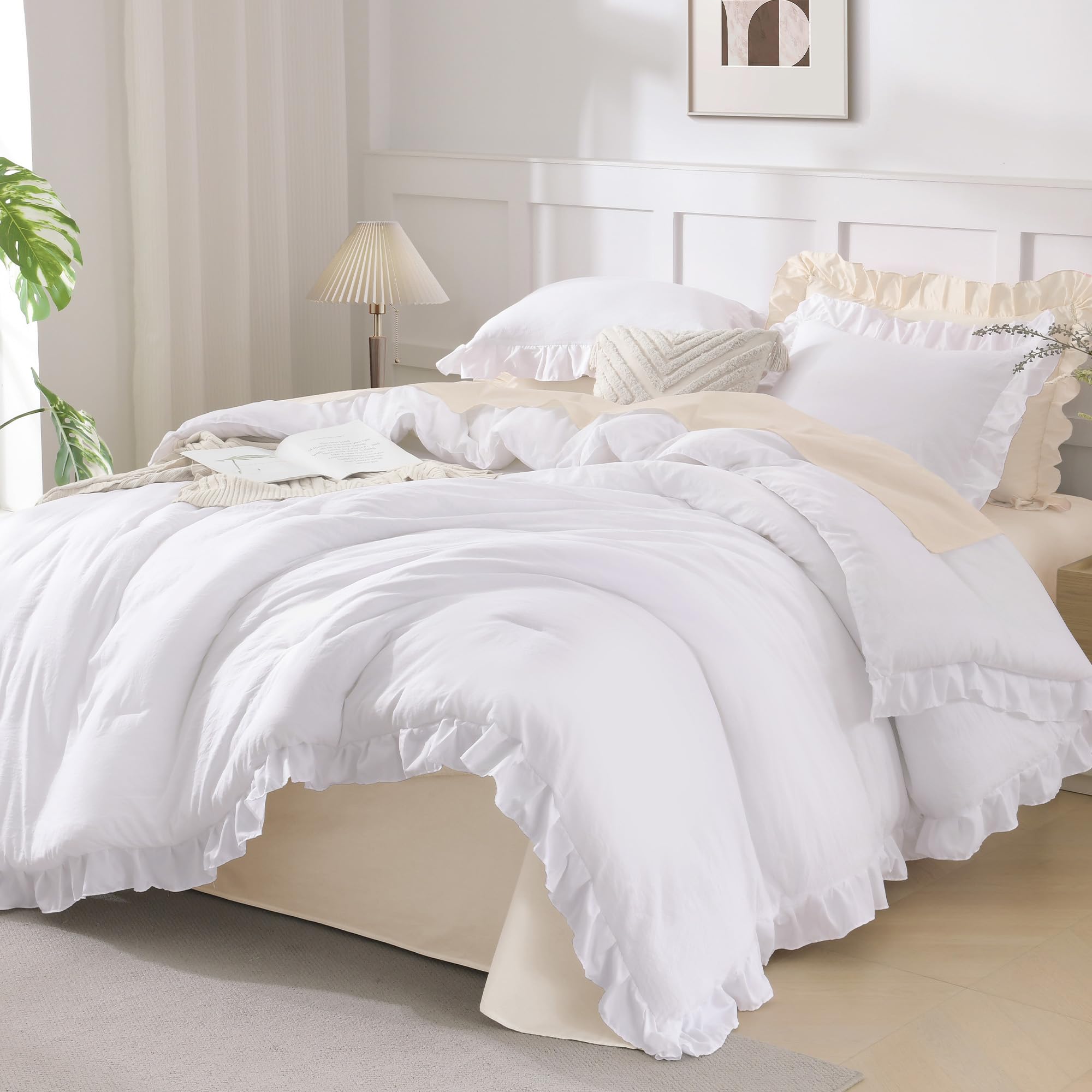 Andency white comforter with ruffle detail enhances elegant bed styling.