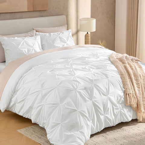 Andency white full-size comforter on bed showing pinch pleat elegance for refined decor.