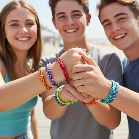 Students and teacher celebrate with ANGOLIO bracelets in class photo