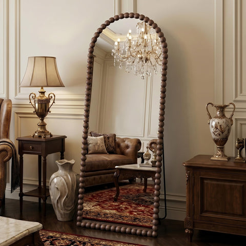 Antok 57x21 arched mirror with beaded frame for elegant room decor.
