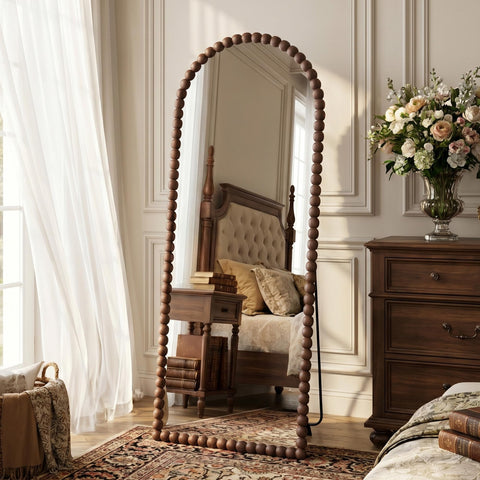 Antok arched full-length mirror in floor-standing design for outfit checks.