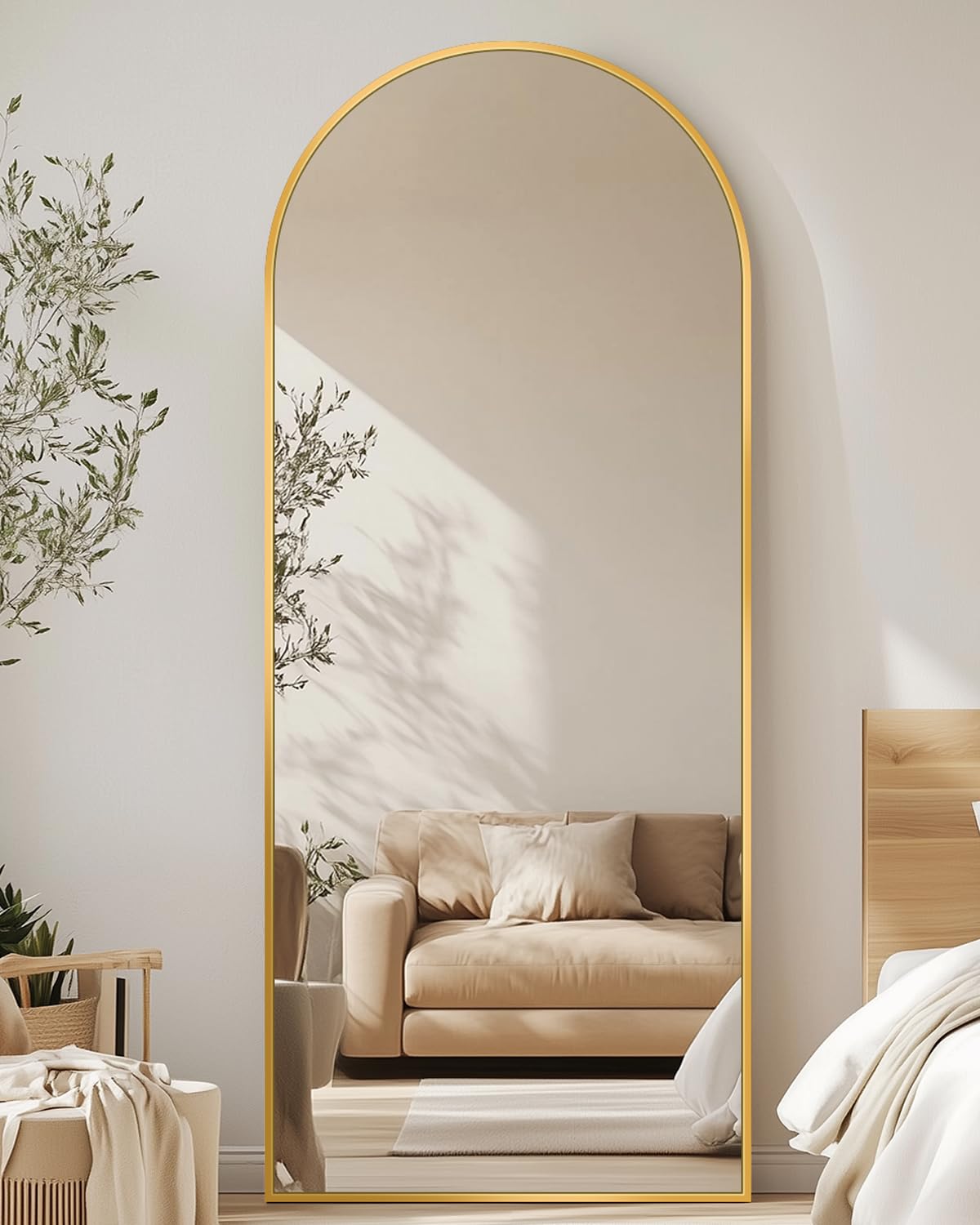 Antok arched full-length mirror frontal view with gold frame for stylish bedroom decor.