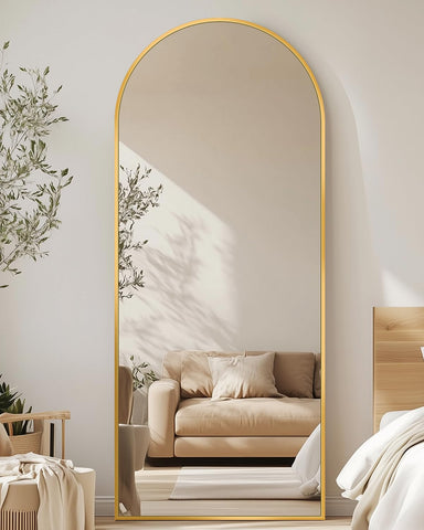 Antok arched full-length mirror frontal view with gold frame for stylish bedroom decor.