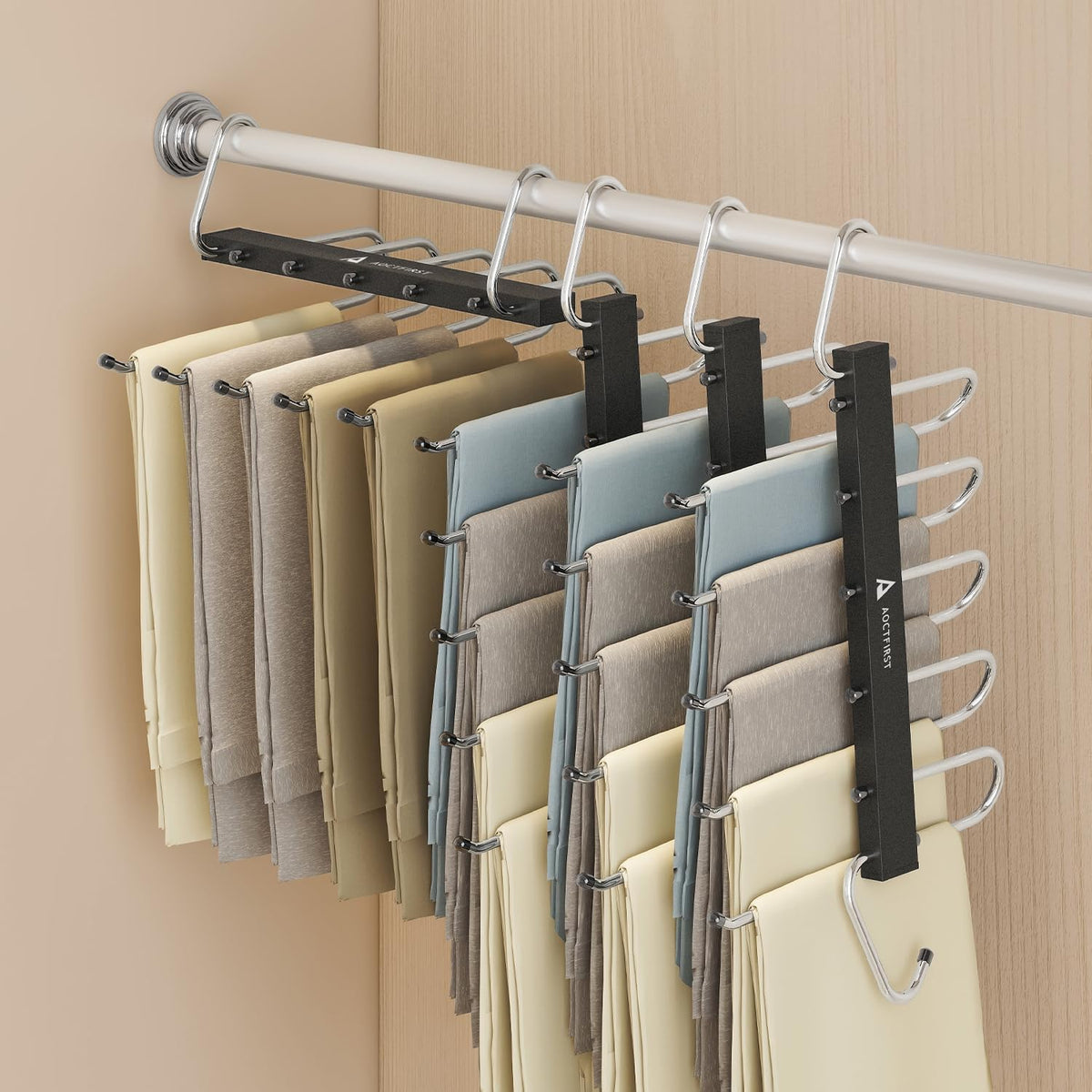 AOCTFIRST 4-pack pants hangers in a compact closet setup for organized space.