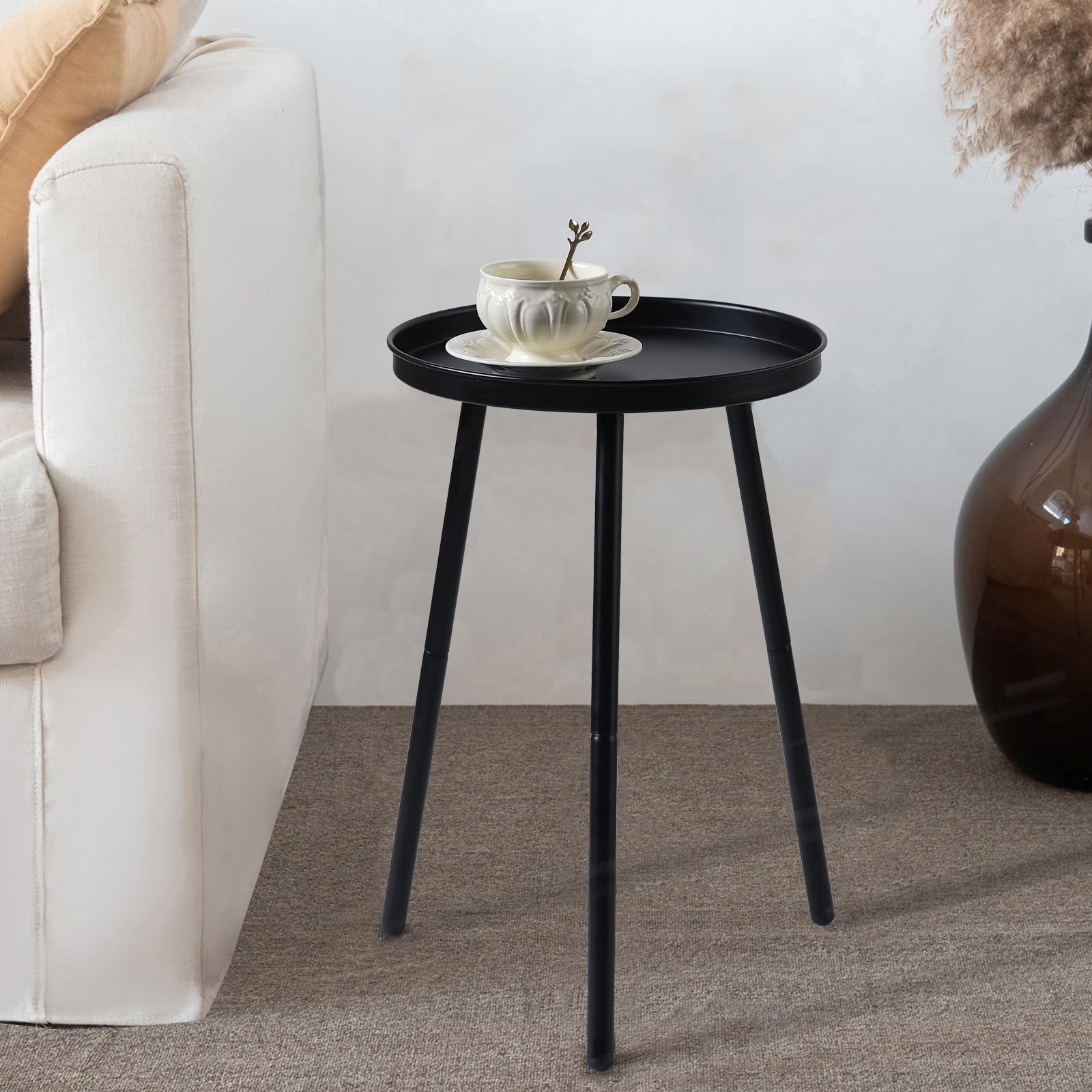 AOJEZOR bedside round table with compact footprint for small bedrooms.