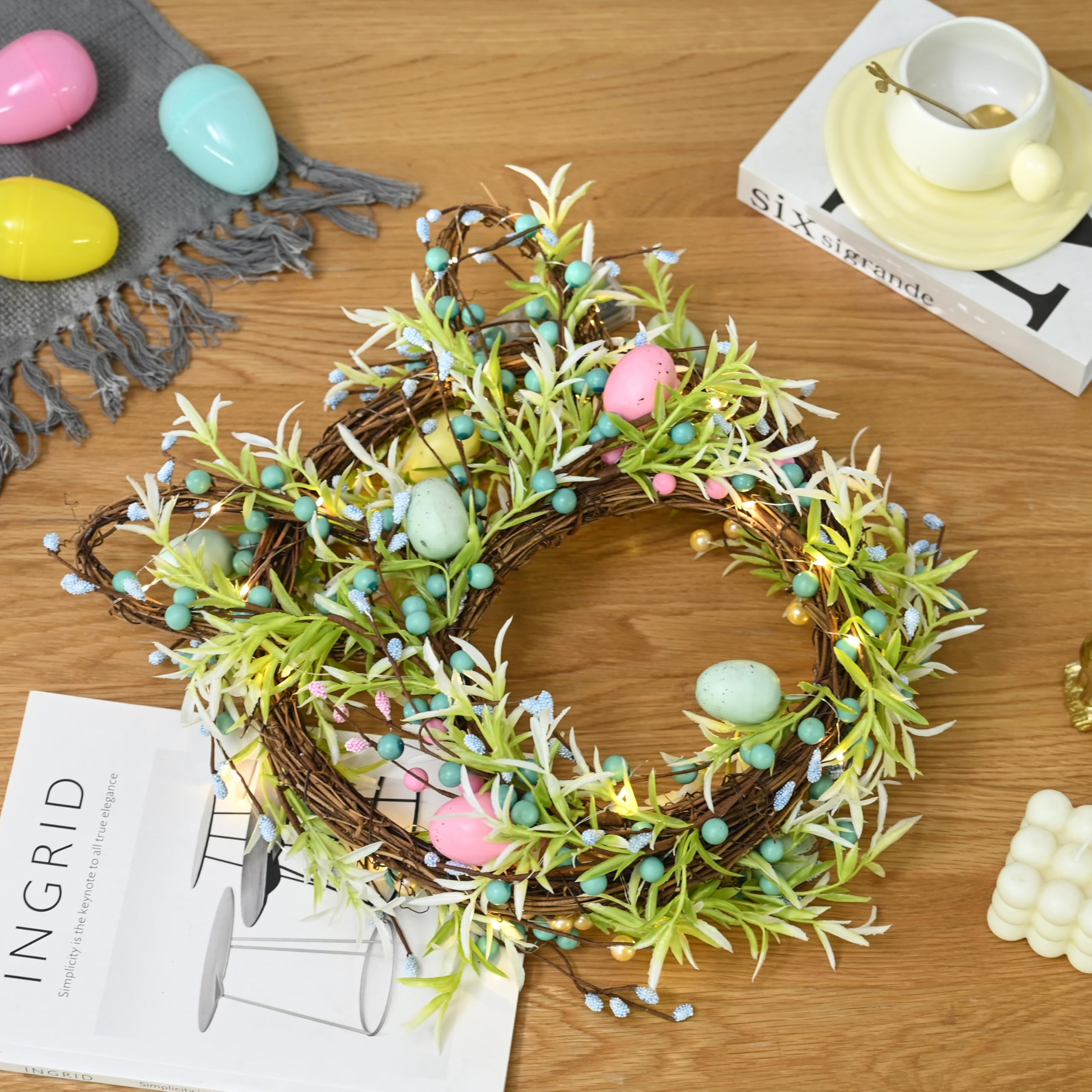 Green grapevine wreath with leaves and pastel eggs by AOMOONOA