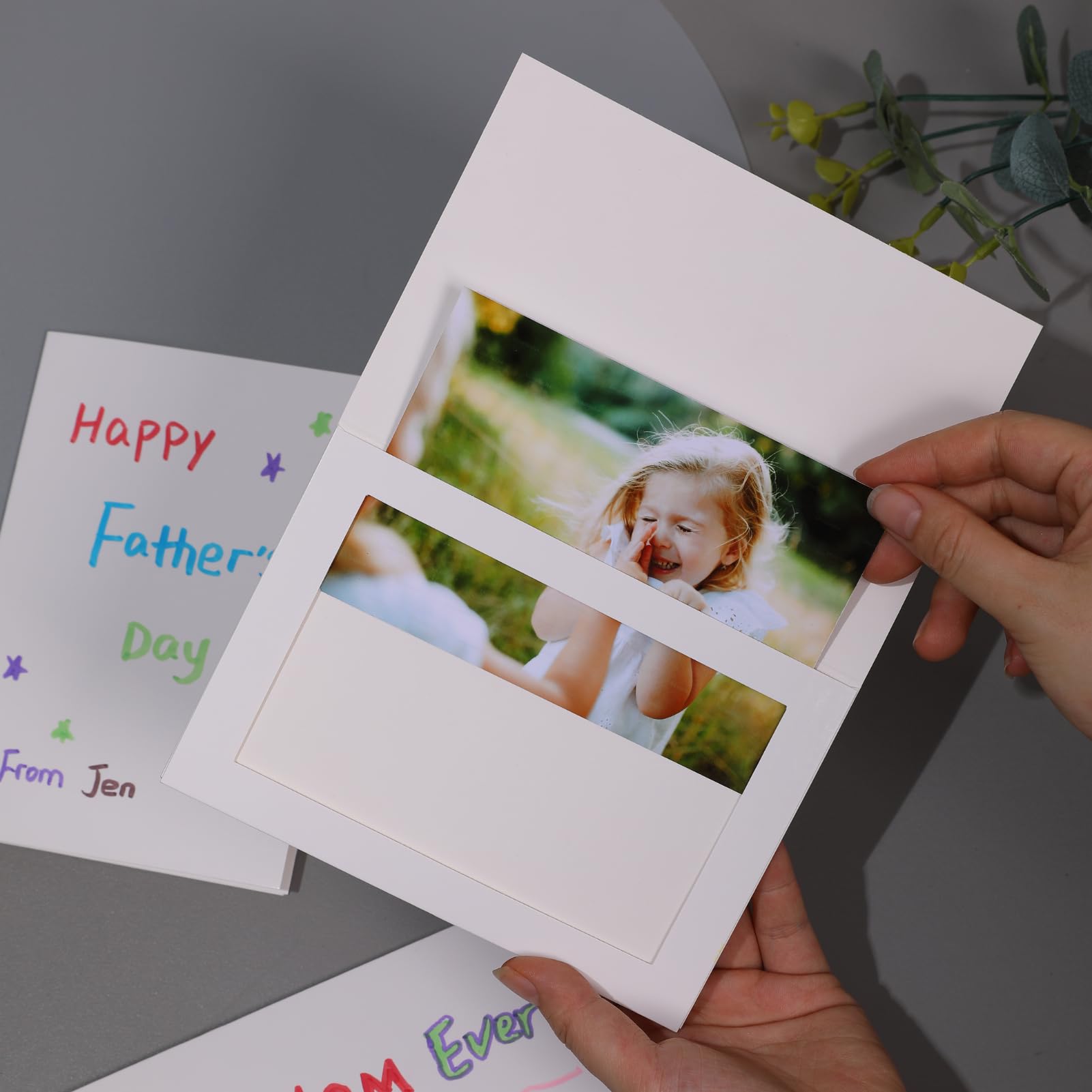 Apprabbr foldable cards protect photos while on display.