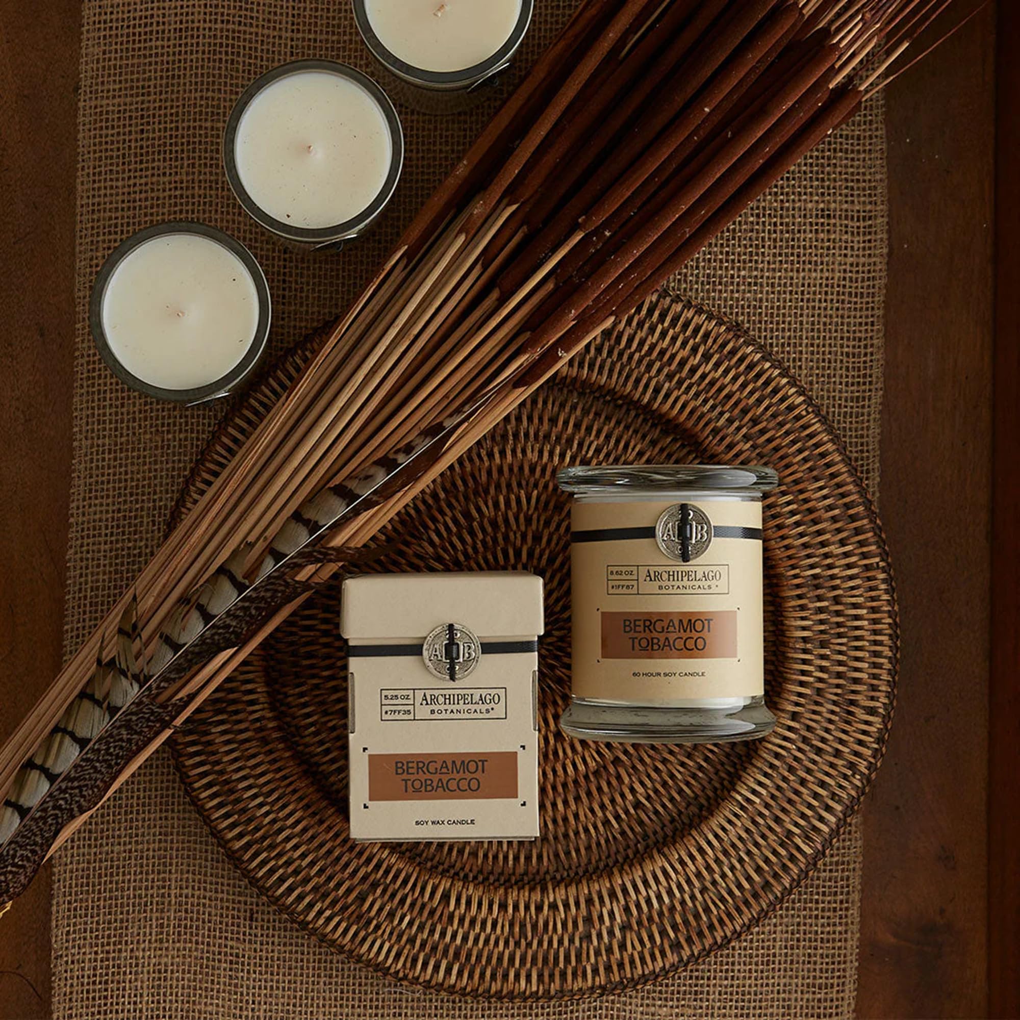 Archipelago Botanicals candle in a room setting, casting a warm, cozy glow.