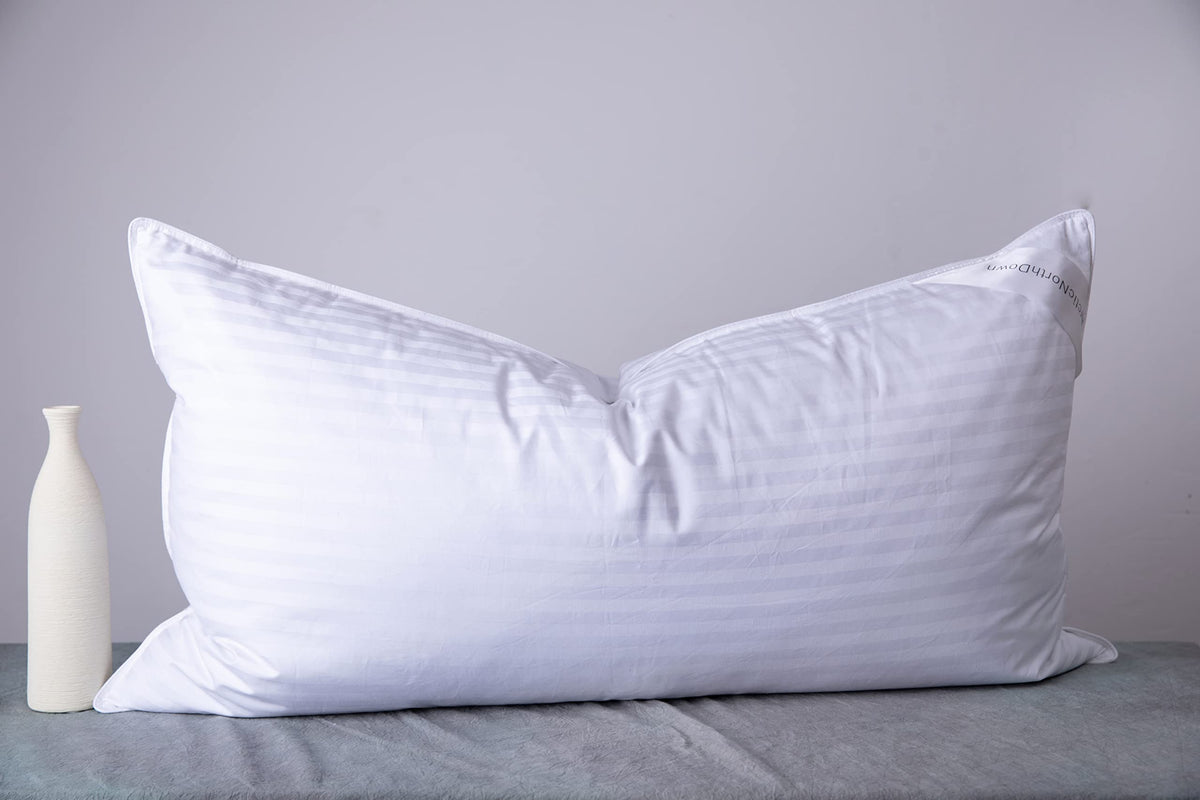 ArcticNorthDown king size pillow with striped white cotton cover for all sleeping positions.