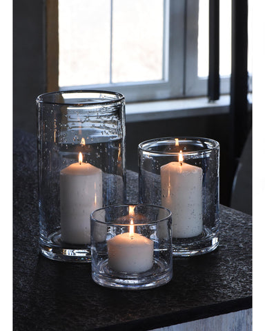 ARIAMOTION hurricane candle holders in hand blown glass with seeded bubbles adding refined dining ambience.