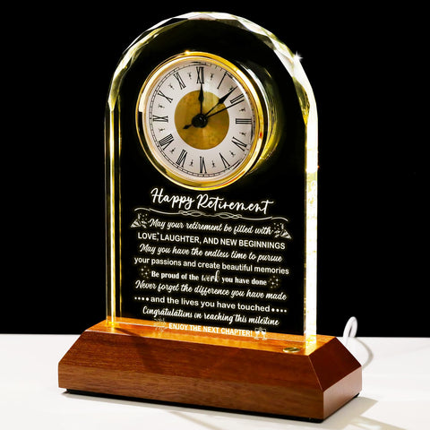 Arikyrist glass retirement clock on wood base, ideal for desk display.
