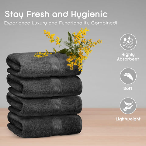 Ariv 30x52 inch bath towels spread on bed, generous coverage after shower.