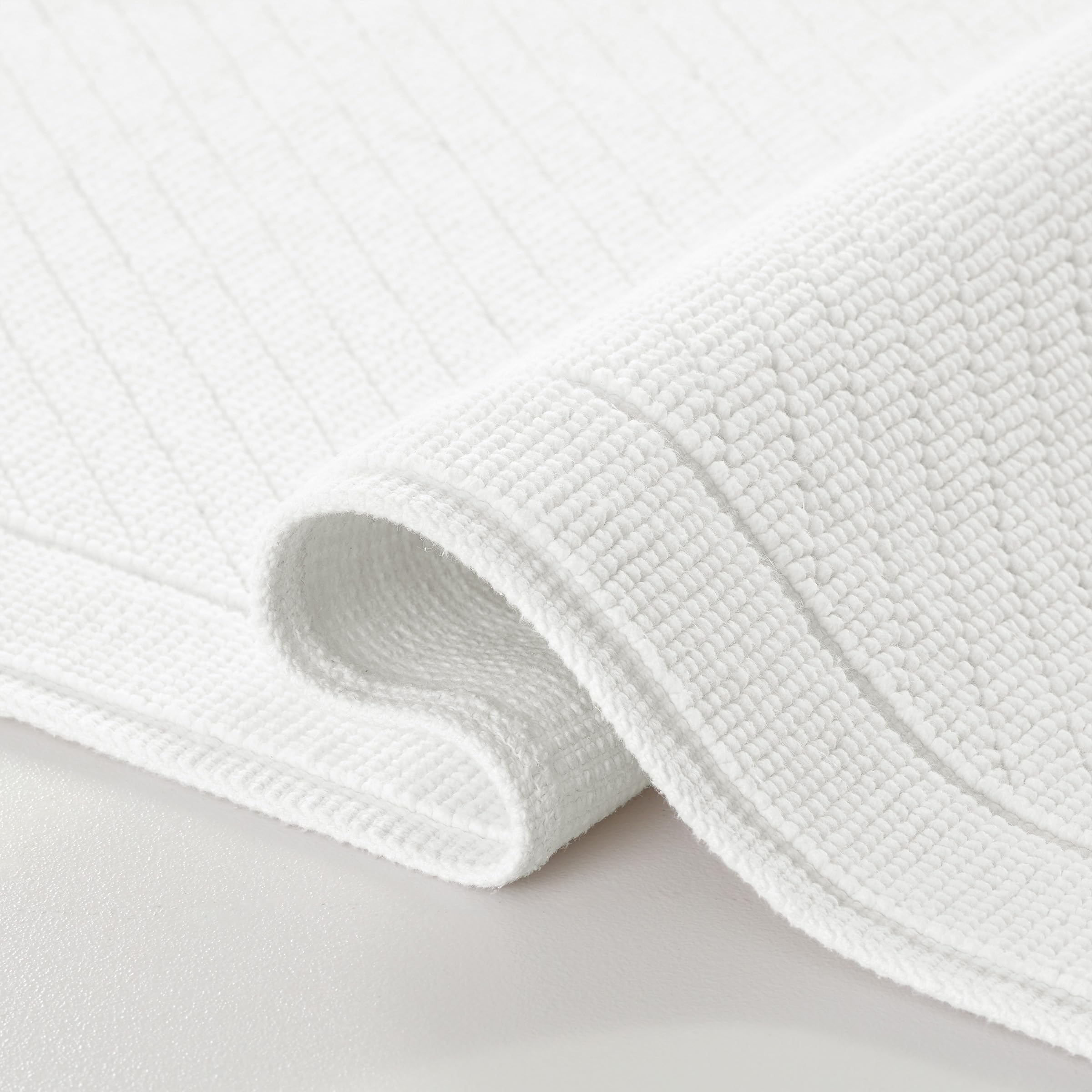 Arkwright bath rug textured weave white 20x32 for quick absorption on bathroom floor