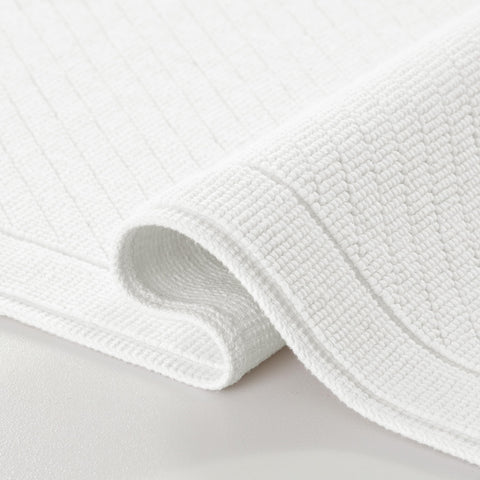 Arkwright bath rug textured weave white 20x32 for quick absorption on bathroom floor