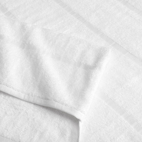 Arkwright Las Rayas absorbent lounge cover dries quickly after swims