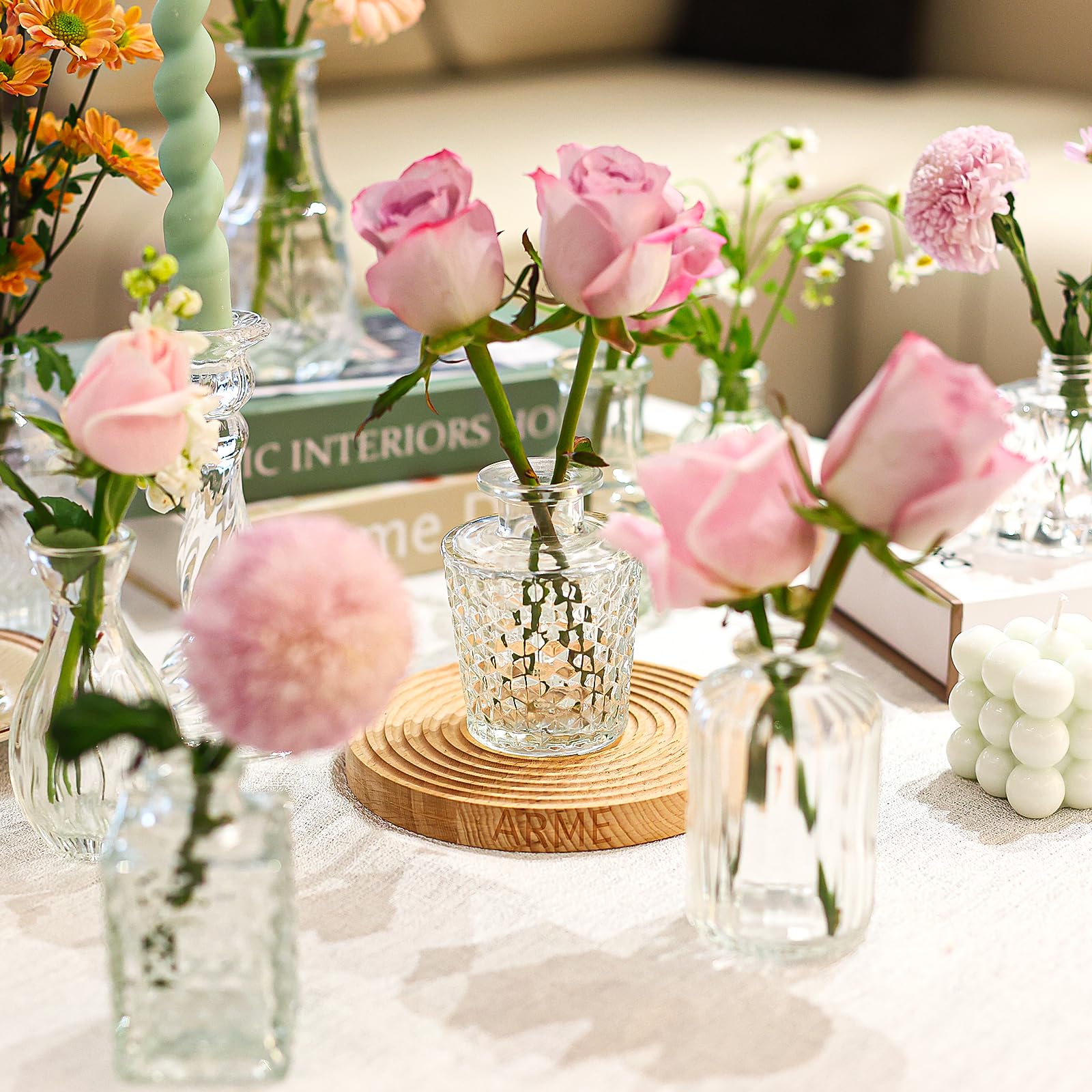 Arme hand-blown borosilicate vases offer smooth surfaces and durability.