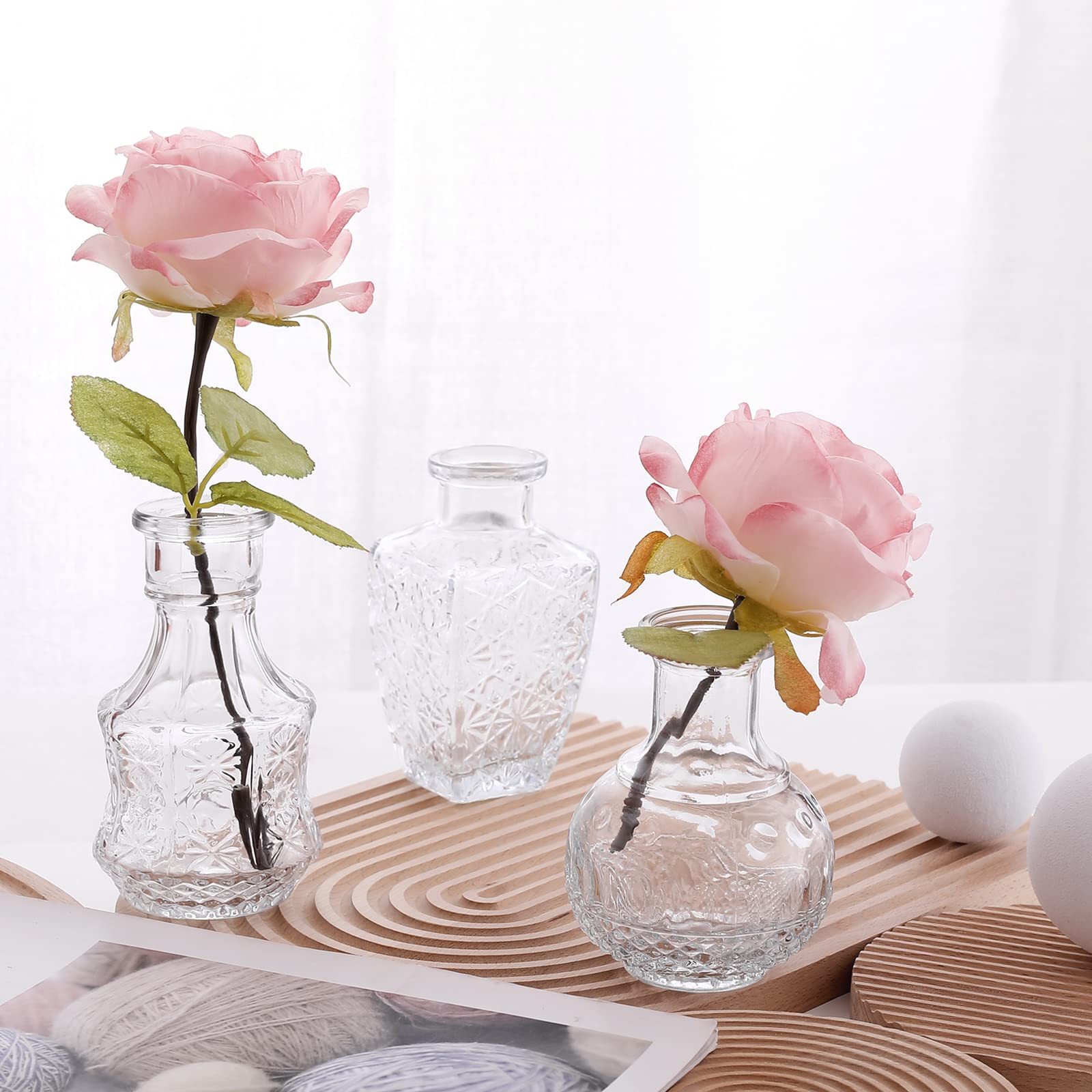 Arme wedding table decor vases create subtle elegant displays.