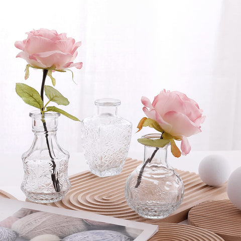 Arme wedding table decor vases create subtle elegant displays.