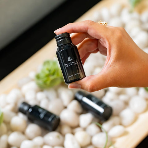 AROMAPLAN Dubai fragrance bottle shown with diffusers for consistent scent.