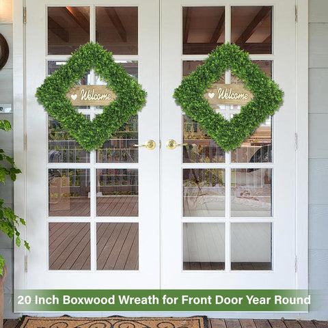 Artgar boxwood wreath on front door doubles as indoor wall décor