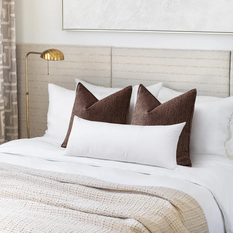 Artscope lumbar pillow on sofa highlighting back support and stylish décor.