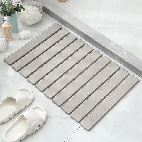 Asou Stone Bath Mat folded for compact storage and quick setup.